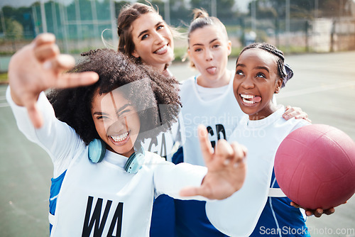 Image of Selfie, frame and a woman netball team having fun on a court outdoor together for fitness or training. Portrait, sports and funny with a group of athlete friends posing for a photograph outside