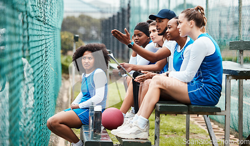 Image of Sports, talking and coach with women at netball, training and watching a game for planning. Teamwork, learning and man coaching girls on sport, discussing a plan and strategy for a competition