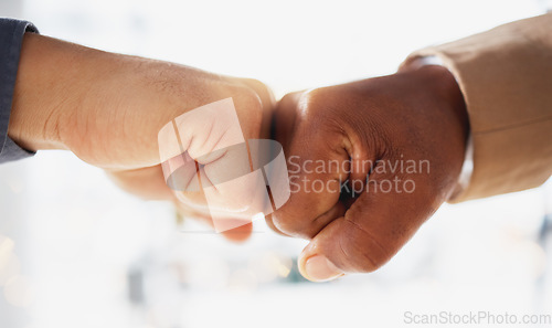Image of Business people, hands and fist bump in partnership, unity or trust for deal or agreement against blurred background. Hand of team bumping fists in collaboration, teamwork or goals in support for win