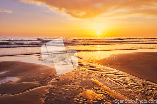 Image of Atlantic ocean sunset with surging waves at Fonte da Telha beach, Portugal