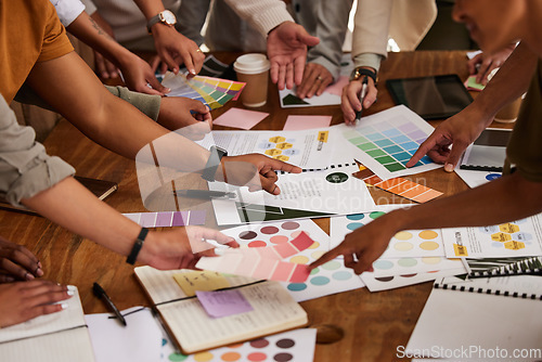Image of Creative, hands and color palette on table in meeting for planning, brainstorming or design strategy at office. Hand of group interior designers in teamwork, project plan or swatch ideas for startup