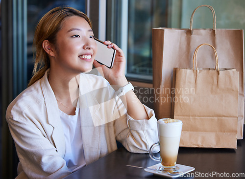 Image of Phone call, shopping mall and Asian woman in cafe with coffee talking, chatting and in conversation. Communication, fashion and happy girl on mockup smartphone for discount news, retail deal and sale