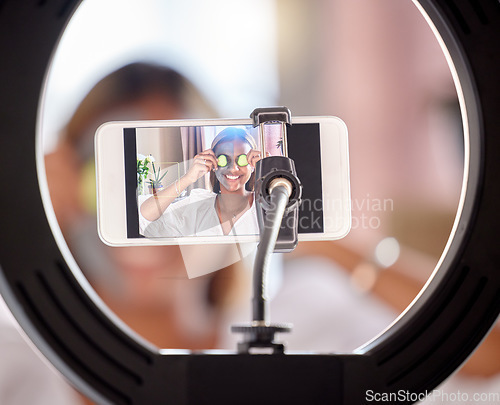 Image of Live streaming, phone and woman in ring light for skincare tutorial, influencer or online social media post at home. Happy female vlogger smile in beauty face mask for internet vlog or mobile podcast