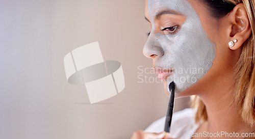 Image of Woman brush clay makeup on face, mask and detox beauty benefits with mockup wall space. Young female apply charcoal skincare product, facial cosmetics and aesthetic cleaning for dermatology wellness