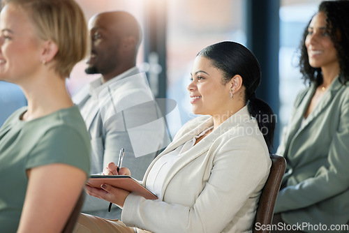 Image of Seminar audience, crowd and business people listening at presentation conference, training workshop or trade show event. Happy woman writing notes, group meeting and team listen to tradeshow speech