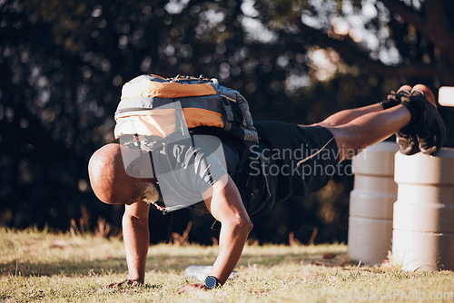 Image of Pushup, elderly and black man at a fitness bootcamp for exercise, workout and sports. Strong, bodybuilder and athlete doing a cardio challenge, physical activity and strength routine on a field