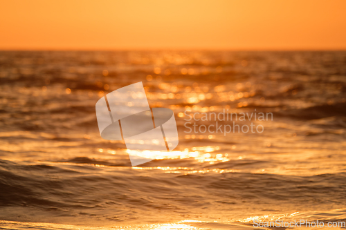 Image of Ocean on sunset background