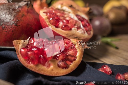 Image of Pomegranate fruit on rustic table