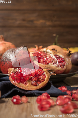 Image of Pomegranate fruit on rustic table