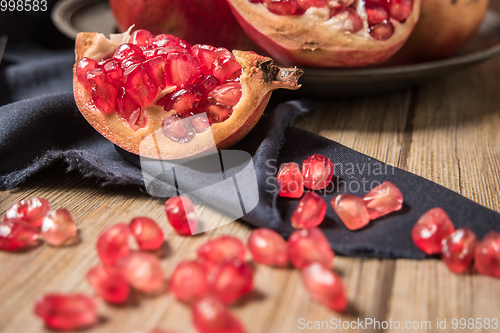Image of Pomegranate fruit on rustic table