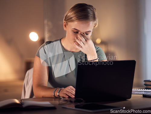 Image of Work stress, headache and computer work at night in a office with project report deadline. Working in dark, anxiety and burnout of a corporate worker with a laptop problem and glitch feeling fatigue