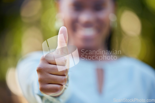 Image of Hand, closeup and thumbs up by black woman showing yes, recommendation or thank you on bokeh background. Zoom, hands and emoji sign, symbol or icon by corporate employee in agreement, support or vote