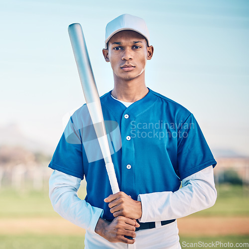 Image of Portrait, baseball and bat with a sports black man outdoor on a field standing ready to play a competitive game. Fitness, exercise and training with a serious male athlete outside at a sport stadium