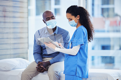 Image of Doctor consultation, mask and patient results of a nurse with a black man in a hospital. Clinic, covid conversation and nursing communication with medical data and healthcare discussion for advice