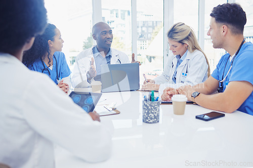 Image of Healthcare, leader and black man in meeting, staff and brainstorming for schedule, deadline and innovation. African American male, staff or group share ideas, laptop or teamwork for procedure or cure