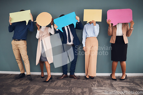Image of Business people, speech bubbles and communication in workplace, logo and feedback against grey wall. Group, staff and teamwork for advertise campaign, opinion and announcement with banner or creative