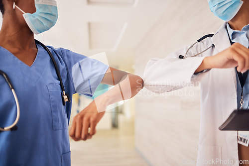 Image of Covid, elbow or greeting with a doctor and nurse in a hospital working as a team for healthcare. Teamwork, medical and rules with professional medicine colleagues at work in a clinic during corona