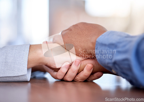 Image of Couple, holding hands and support on table in care, compassion or trust for partnership together. Man and woman touching hand in unity, empathy or understanding for commitment in solidarity on desk