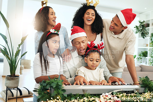 Image of Love, Christmas and family singing, quality time and happiness with bonding, loving and smile. Grandparents, happy mother and father with children, Xmas and festive season with decorations and carols