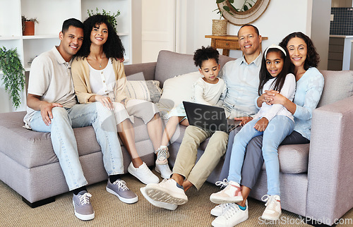 Image of Portrait, laptop and a black family in the living room of a home together, sitting on a sofa. Love, internet or bonding with children, parents and grandparents in the lounge of a house during a visit