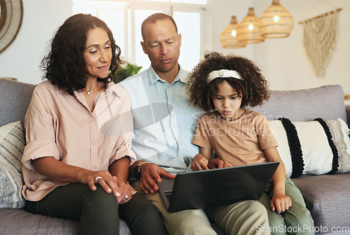 Image of Girl watching a movie on laptop with her grandparents while relaxing on sofa in the living room. Technology, rest and child streaming video or film with grandfather and grandmother for entertainment.