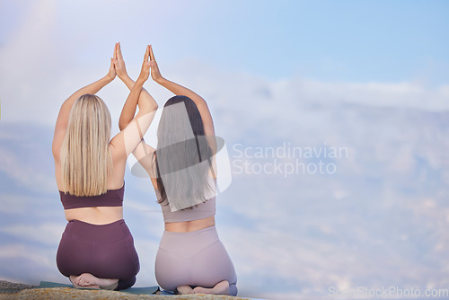 Image of Yoga, namaste hands and people on sky mockup for meditation support, wellness teamwork and healing together. Prayer of friends, women or people on mountain for praying, faith or zen fitness in rear