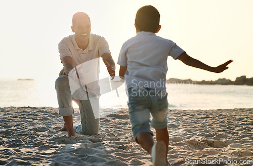 Image of Fun, playful and father with a child at the beach for bonding, quality time and playing in Spain. Freedom, happy and smiling father catching a running boy at the ocean for love, care and enjoyment