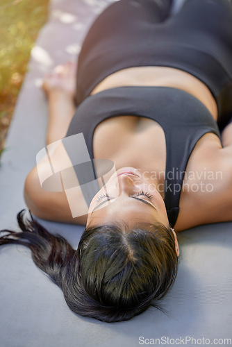 Image of Sleeping, fitness and woman doing yoga in nature for wellness, mindfulness and faith. Relax, peace and girl doing a meditation exercise for stress relief, health and spiritual training in a garden