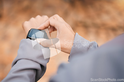 Image of Hands, fitness and smartwatch screen in nature to track health, wellness and workout goals. Sports progress, technology app and woman athlete with watch for time, exercise schedule or running targets