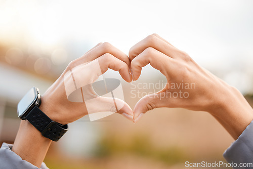 Image of Heart hands, outdoor fitness and health for smartwatch exercise, running or wellness closeup. Cardiology, exercise and healthy person with love sign and smart watch in park or nature for care emoji