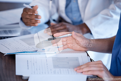 Image of Doctors, hands and paperwork of people for research, healthcare planning and analysis. Hospital staff, medical documents and consulting in clinic, team and expert advice of decision making results