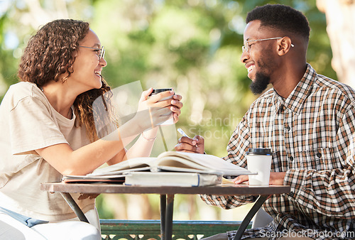 Image of Black couple, coffee and happy outdoor on a date while studying, talking and bonding at table. Man and woman students with a drink or tea to relax, study and talk about love and care at cafe or shop