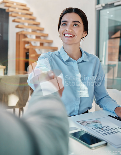 Image of Business woman, handshake and smile for b2b, partnership or meeting in agreement at office desk. Happy female employee shaking hands with colleague for greeting, deal or welcome at workplace