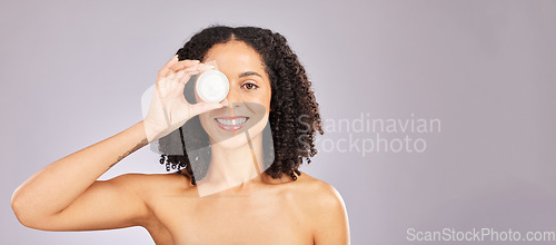 Image of Skincare, face and black woman with cream container in studio isolated on a gray background mockup. Dermatology portrait, cosmetics and happy female with lotion, creme or moisturizer for skin health.