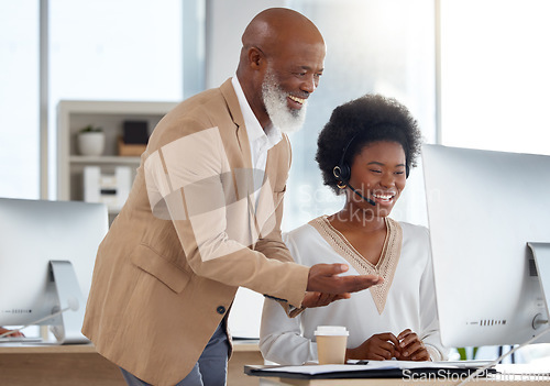 Image of Call center, customer support and manager helping a consultant with an online consultation. Contact us, professional and African male leader training a female employee with crm strategy in the office