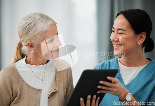 Image of Asian woman nurse, elderly patient and tablet for consulting, healthcare or report for medical help. Japanese doctor, women and digital touchscreen ui at consultation room, happy or smile for results