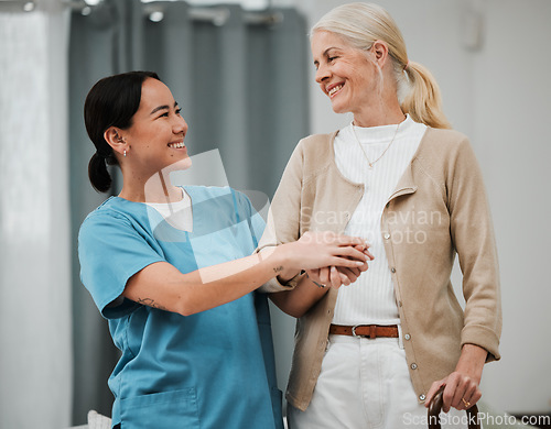 Image of Senior woman, support and walking stick with nurse holding hands for disability help or retirement nursing. Elderly patient or disabled person with friendly home caregiver for Parkinson or arthritis