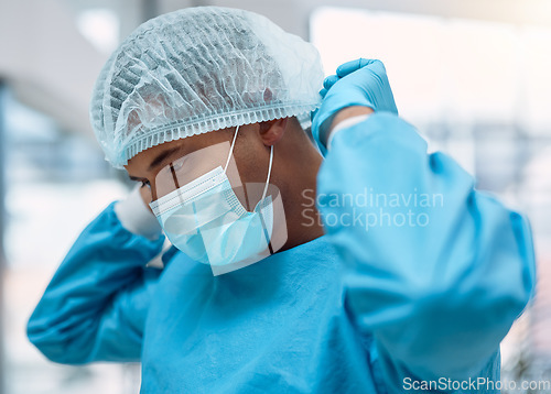 Image of Surgeon, doctor and surgery with face mask and health, man in ppe for safety, operation and ready for procedure. Cardiovascular healthcare, clean scrubs and person in clinic with male physician