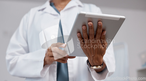 Image of Hands, tablet and medical doctor in hospital for research, telehealth or online consultation. Healthcare, technology and senior woman or female physician with digital touchscreen for wellness app.