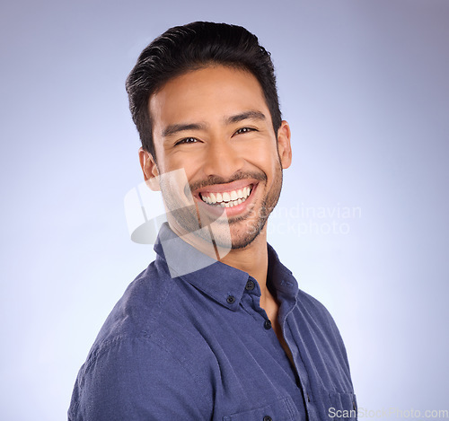 Image of Business man, smile and portrait of a marketing manager from the Philippines in a studio. Isolated, blue background and happiness of a businessman and entrepreneur ready for professional working