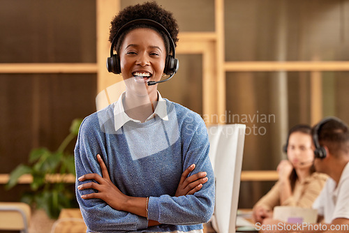 Image of Call center, arms crossed and portrait of black woman laughing at funny joke in customer service office. Crm consulting, proud sales agent and happy telemarketer, representative or female consultant.