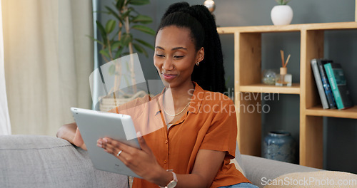 Image of Greeting, tablet and video call with young black woman on digital touchscreen while sitting on sofa of living room at home. Communication, video conference and internet with female on social media