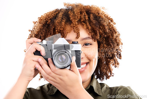 Image of Camera, black woman and portrait of a young person taking a picture in a studio. Isolated, white background and photography shooting with a female feeling happiness with a smile from creativity