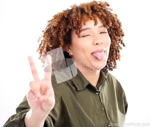 Image of Black woman, tongue out and wink with peace hand sign and goofy, playful and smile isolated on white background. Happy person, funny face with v, emoji and crazy with female in portrait and gen z