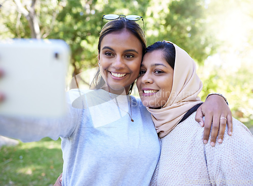 Image of Girl, friends and islam for selfie in park with smile, hug and happy for summer, adventure or outdoor bonding. Women, muslim and profile picture for social media app, happiness and together in nature