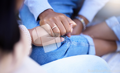 Image of Holding hands, friends and closeup for black woman with trust, care and solidarity for grief. Women, support and helping hand for consultation, conversation and listening to cancer problem with love