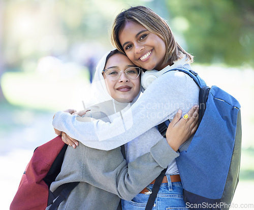 Image of Islamic women, portrait or hug in park, garden or school campus for bonding, friends acceptance or community support. Smile, happy or Muslim students in embrace, fashion hijab or university college