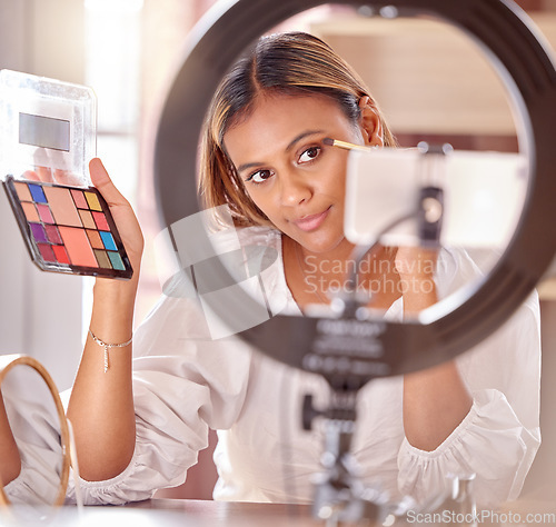 Image of Makeup, influencer and woman live streaming with eyeshadow for beauty, cosmetics and fashion vlog. Content creator, social media and girl record, review and filming tutorial on phone with palette