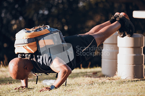 Image of Exercise, black man and push up for training, outdoor and training for wellness, workout challenge and fitness. African American male, athlete and guy with backpack, park and motivation for energy