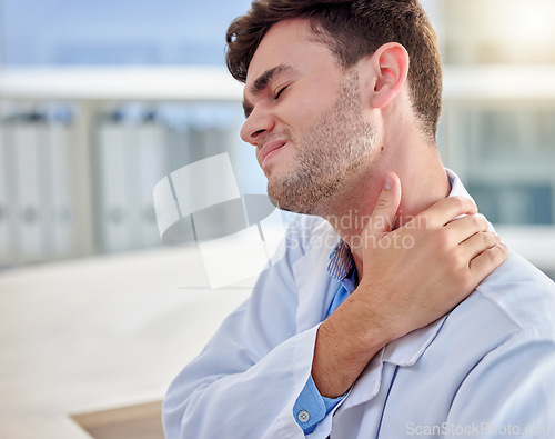 Image of Tired, stress and man or doctor neck pain in office overworked, burnout or tension for healthcare problem. Medical professional worker, frustrated person or nurse with muscle injury at desk